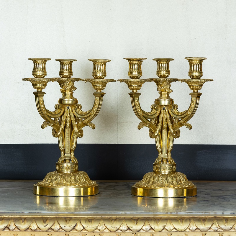 A pair of French Louis XVI ormolu table candelabra